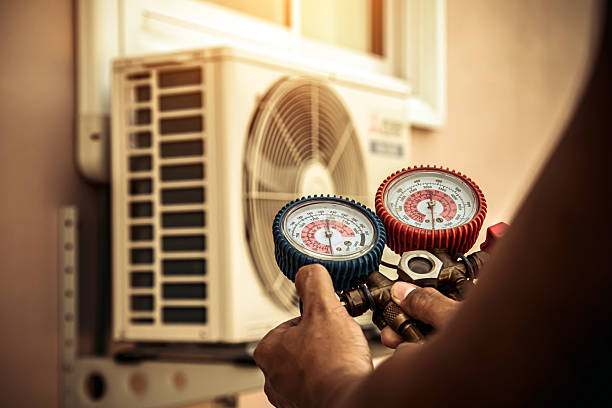 Professional Ductwork Repair technician working in Dracut, MA
